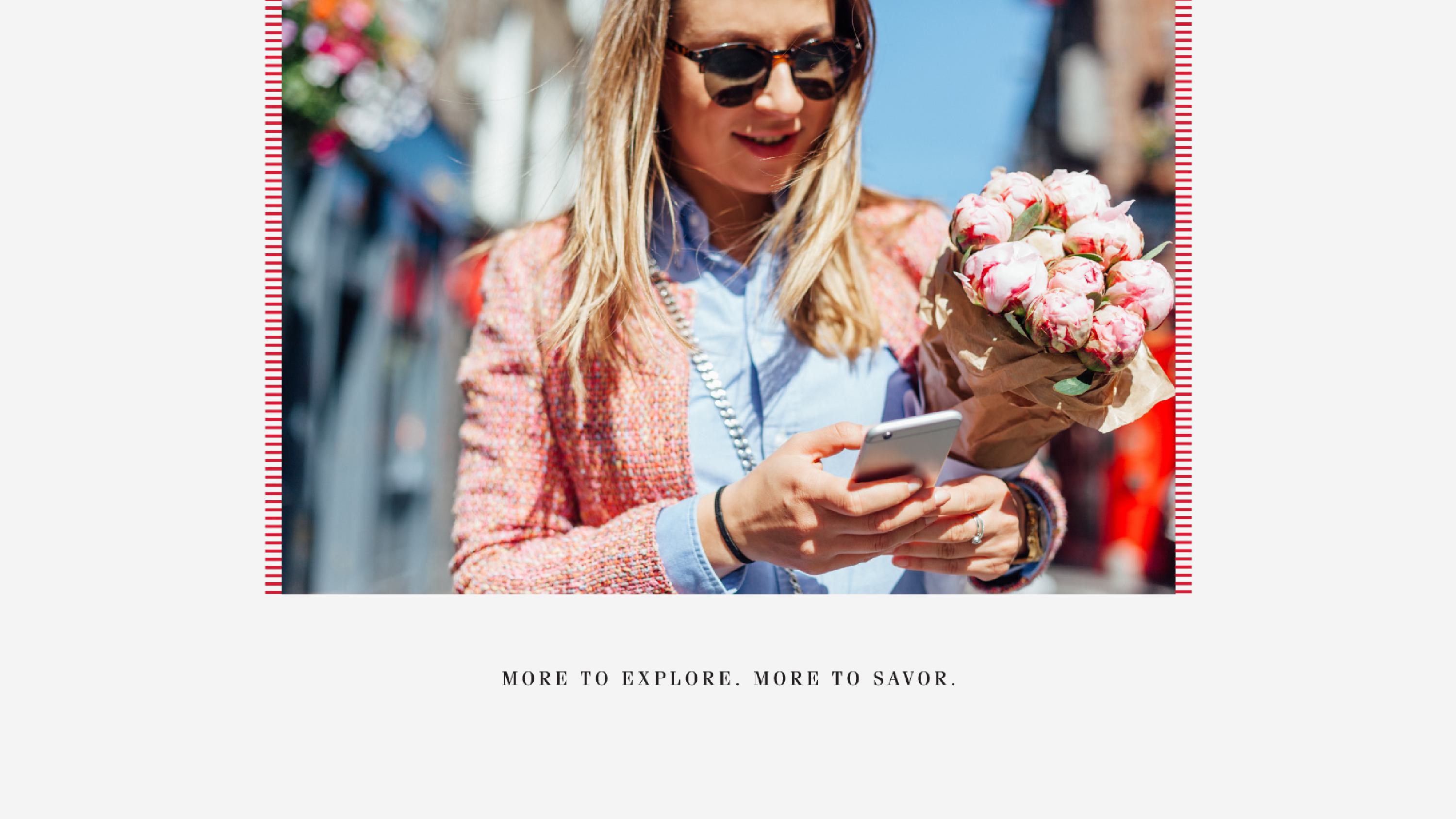 A panel from the identity guide - a women walking with flowers, looking at a mobile phone.