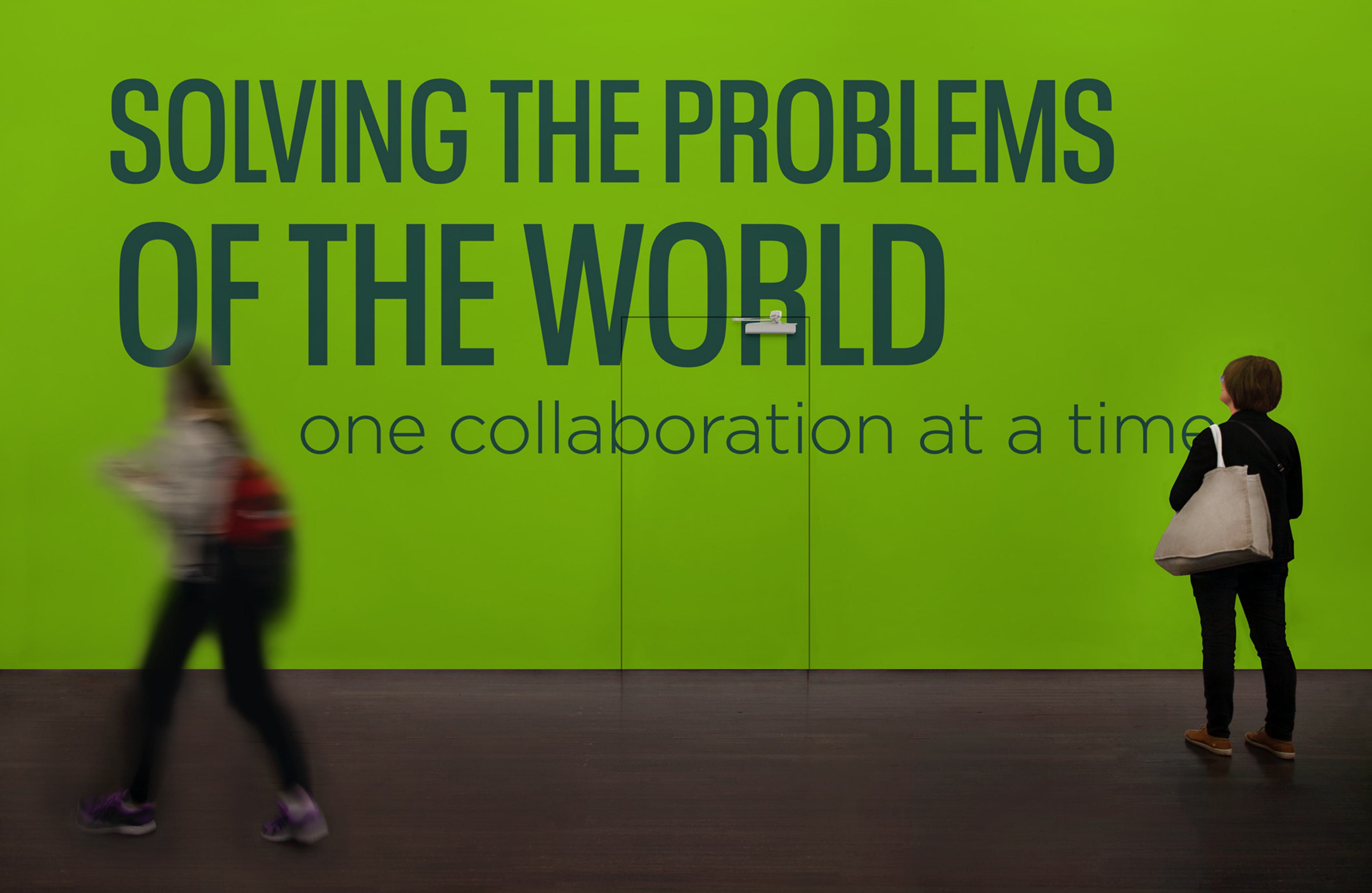 a mock of a wall graphic - 'Solving the problems of the world, on collaboration at a time.