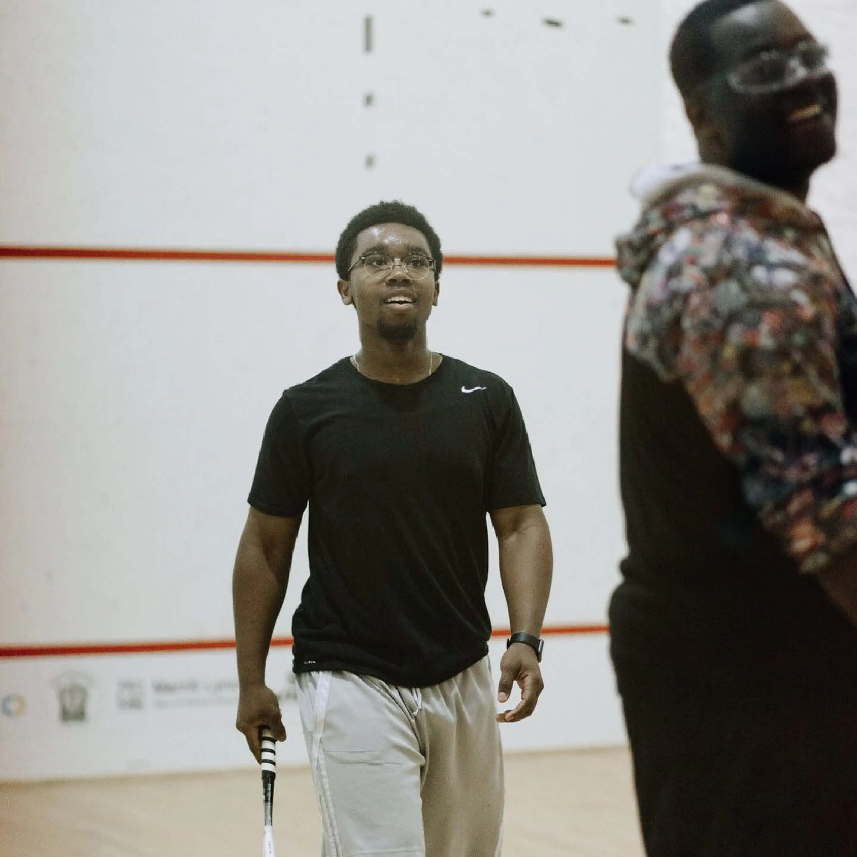 Two players captured in a moment between points.